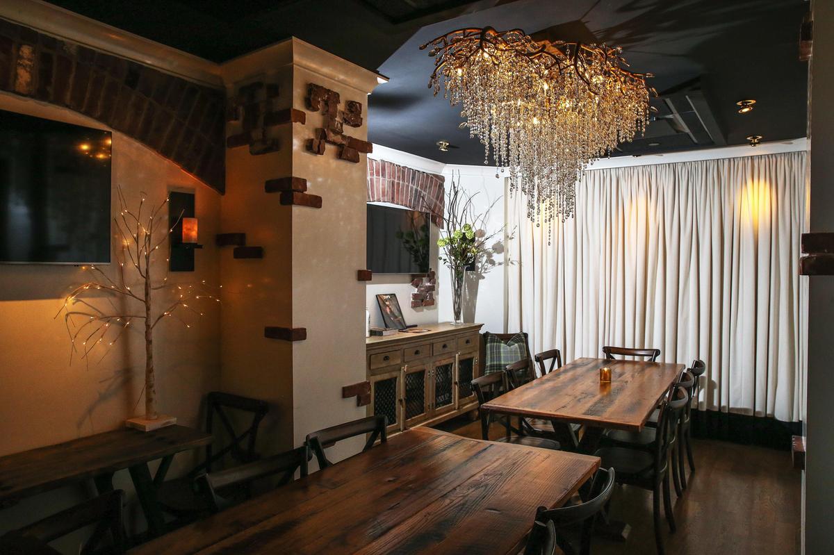 The private dining room at Graze features a large chandelier.