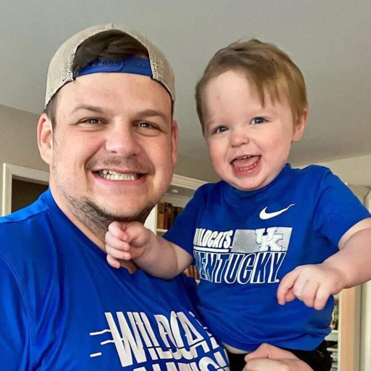 Corbin’s Daniel Reeves, a 30-year-old, married father of three, is the inventor of “Big Blue Roulette,” a Kentucky Wildcats-centered online game that has become a mini-sensation among UK fans. Reeves is pictured with his son, Asher, prior to watching a Kentucky basketball game on television.