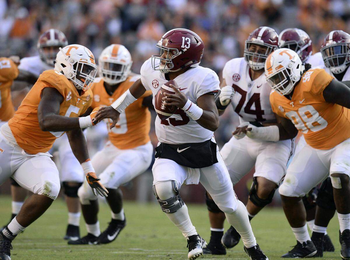 Tennessee defensive lineman Kyle Phillips (5) chased Alabama quarterback Tua Tagovailoa (13) during the Crimson Tide’s 58-21 win over the Volunteers Oct. 20. Phillips scored a touchdown on a 27-yard interception return in the third quarter of the game.
