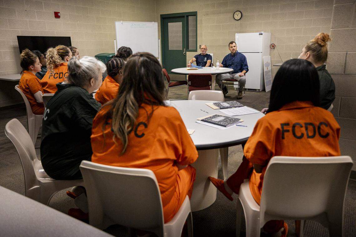 Mason King, center, speaks to people who were incarcerated during a Second Chance Academy class on Thursday, Aug. 7, 2025, at Fayette County Detention Center in Lexington, Ky. 