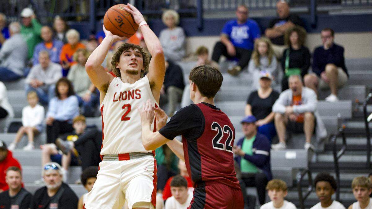 Boyd County’s Jacob Spurlock (2) went up for a shot against McCracken County’s Garrett Miller during the first round of the White, Greer & Maggard Holiday Classic at Lexington Catholic High School on Saturday.