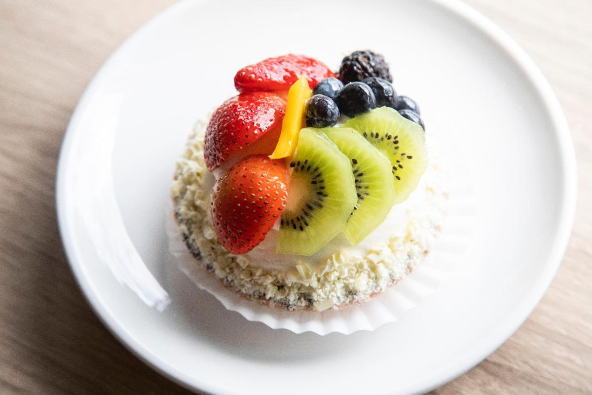 A fruit tart, cookie bottom crust brushed with chocolate, filled with pastry cream, and fresh fruit on top from European Delights Bakery in Nicolasville.