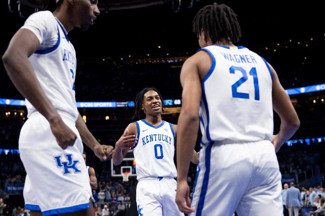 Kentucky guard Rob Dillingham celebrates with D.J. Wagner during the Wildcats’ 87-83 win over North Carolina on Saturday.