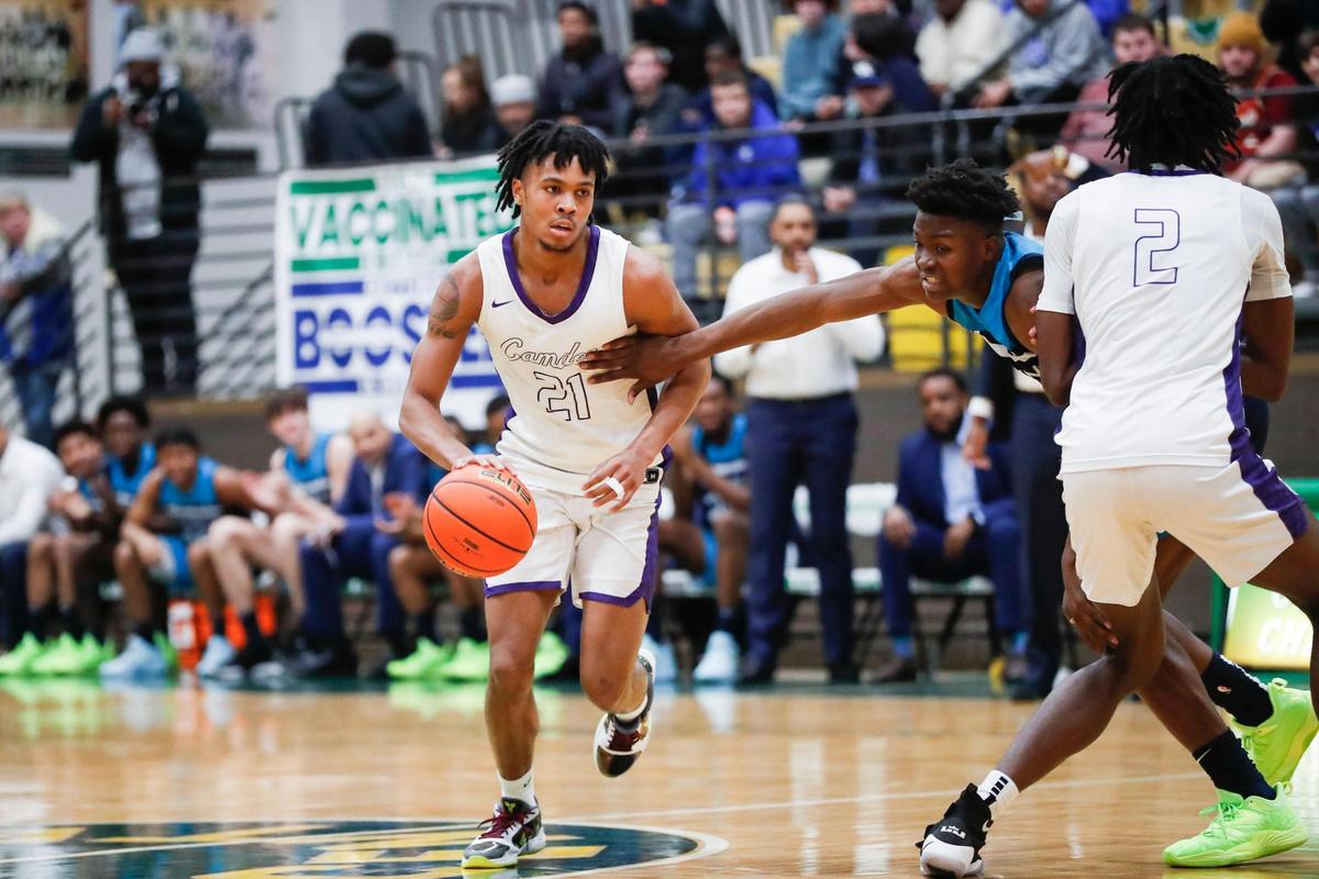Camden (N.J.) High School guard and Kentucky men’s basketball 2023 signee DJ Wagner (21) dribbles the ball against Combine Academy (N.C.) during a game at the William Exum Center at Kentucky State University in Frankfort, Ky., Friday, February 3, 2023. Wagner picked Kentucky over other top college programs, including Louisville.