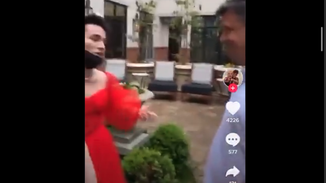 Former VisuWell CEO Sam Johnson is seen in a TikTok video next to Dalton Stevens, who wore a dress to his high school prom.