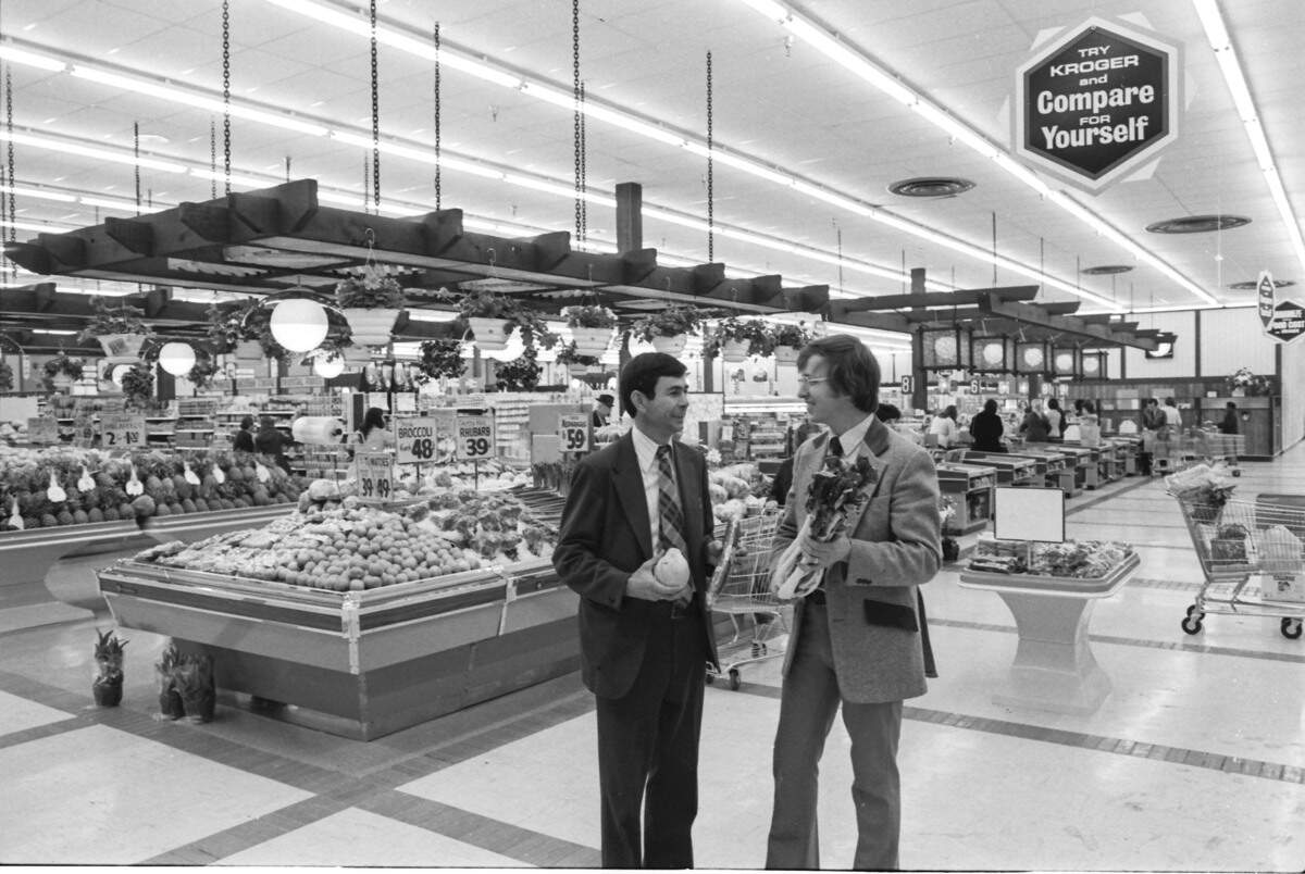 A new Kroger Superstore opened at Nicholasville Road and New Circle in March 1975. Bob Hilen, left, store manager, and Mike Ryan, produce merchandiser, posed in the produce area with some new varieties to the Kroger lineup, including papaya, English cucumbers and bok chow. The store featured produce sold in bulk. The customer selected the quantity desired and an employee was there to weigh it and price it.