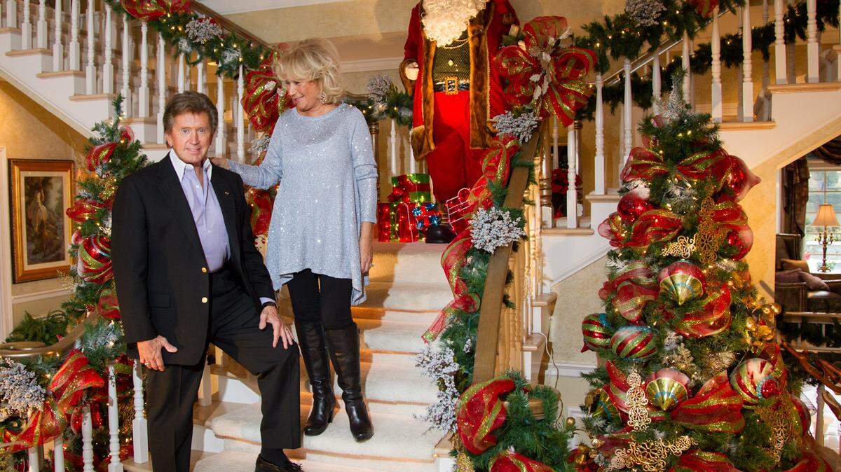Ron and Linda Turner stood on the main staircase of their home that they have had decorated to the nines. The Turners are opening up their home for the first time to the public as a fundraiser to benefit The Foster Care Council of Lexington. For many years the house has attracted drive-by admirers around the holidays because of its thousands of lights and outdoor decorations.