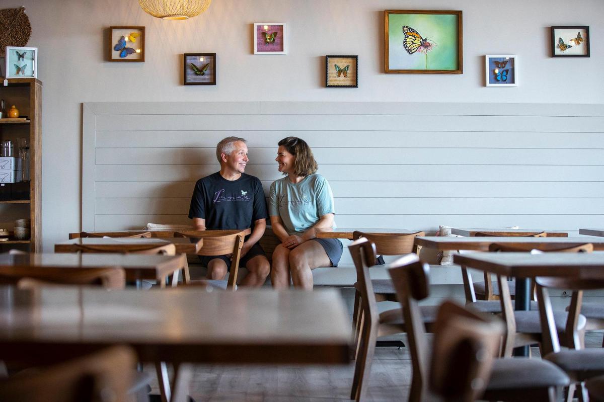 Web Barney, left, and Alison Davis, the husband and wife behind Luna’s Coffee, Wine & Butterfly Cafe, are doing what they can to save their inventory of cups straws and takeout containers.