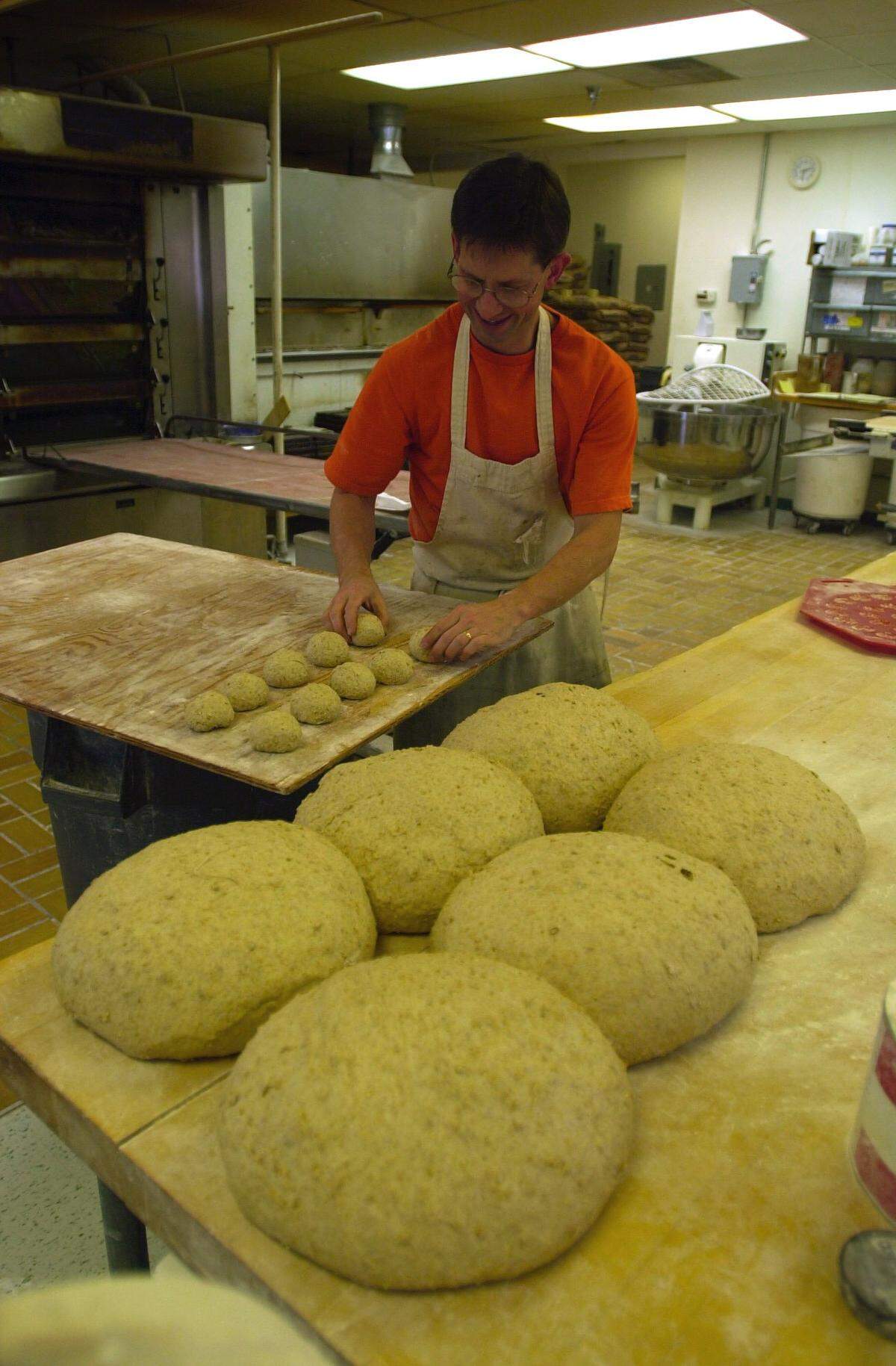 Jim Betts, owner of Bluegrass Baking Company, making bread at his bakery off Clays Mill Road in Lexington, Ky., Oct. 6, 2000.