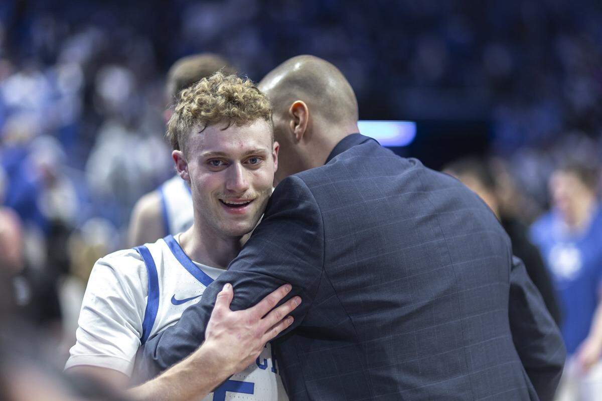 Kentucky guard Collin Chandler gets a hug from UK coach Mark Pope during a game this past season. Chandler will return to the Cats for his sophomore year.