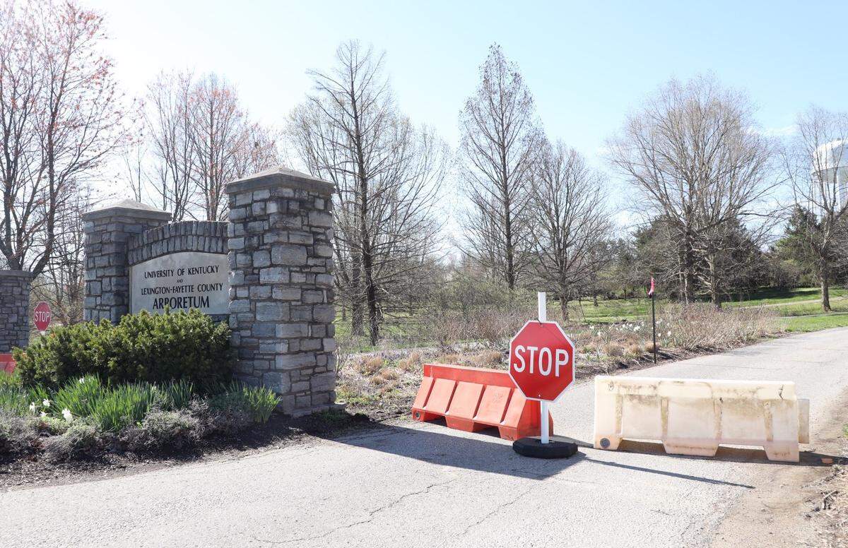 The University of Kentucky has barricaded the parking lot to the Arboretum on Alumni Drive to keep large groups of people from gathering and spreading the coronavirus.