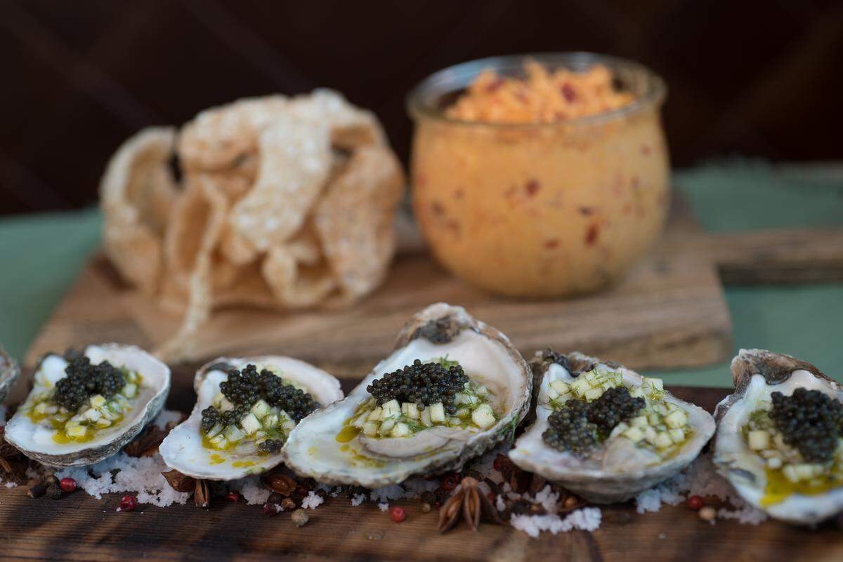Two of the appetizers on the Kentucky Derby menu this year: cracklins' with pimento cheese or chilled oysters with country ham and green apple mignonette, fennel, celery and caviar.