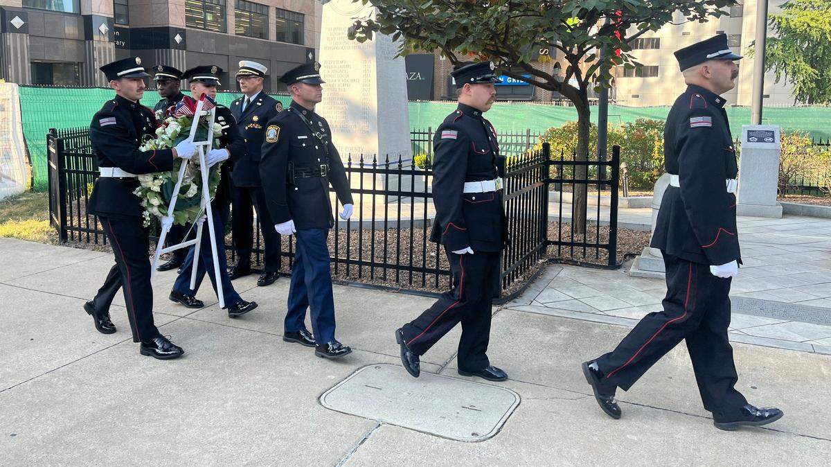 Members of the Lexington Fire and Police Department Honor Guard lay a wreath at the Fallen Firefighters Monument in Phoenix Park in downtown Lexington, Ky. on Sept. 11, 2024.
