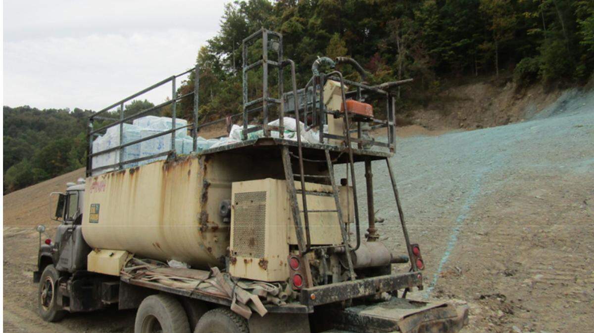 A Kentucky man died when he fell and hit the railing around the top deck of this truck during reclamation work at a surface coal mine.