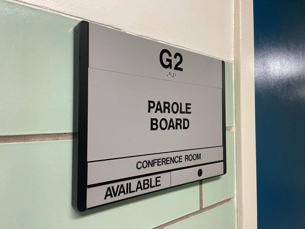 A Kentucky Parole Board meeting sign outside of a conference room where the committee meets to decide to grant or deny parole of state inmates.