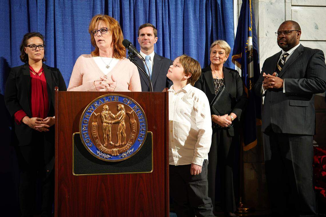 Amanda Bourland, of Louisville, Kentucky, speaks at a press conference before Kentucky Governor Andy Beshear signs an executive order to reinstate the voting rights of over 100,000 non-violent felons who have completed their sentences, at the Capitol in Frankfort, Ky., Thu, Dec. 12, 2019. Bourland was convicted of a drug offenses when he was 18 and will have her voting rights restored with today’s order.