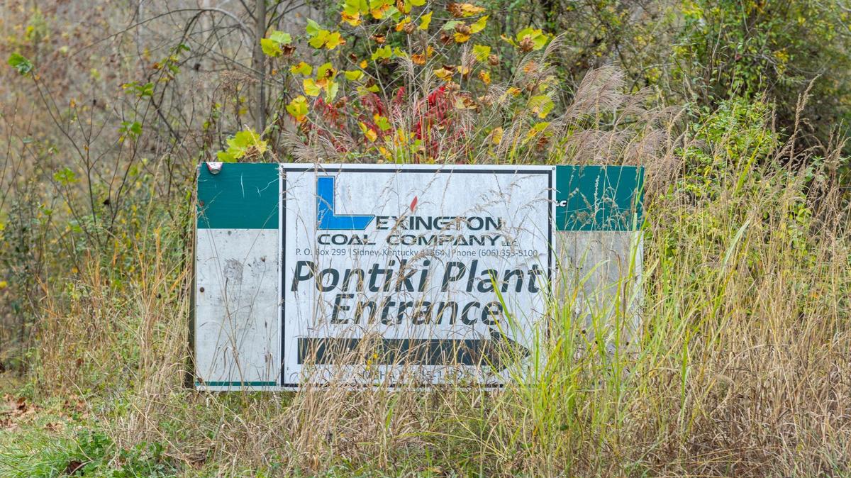 A plant entrance sign stands near a road leading to the area where a rescue operation is underway for two workers trapped inside a collapsed coal preparation plant in Martin County, Ky., on Wednesday, Nov. 1, 2023.