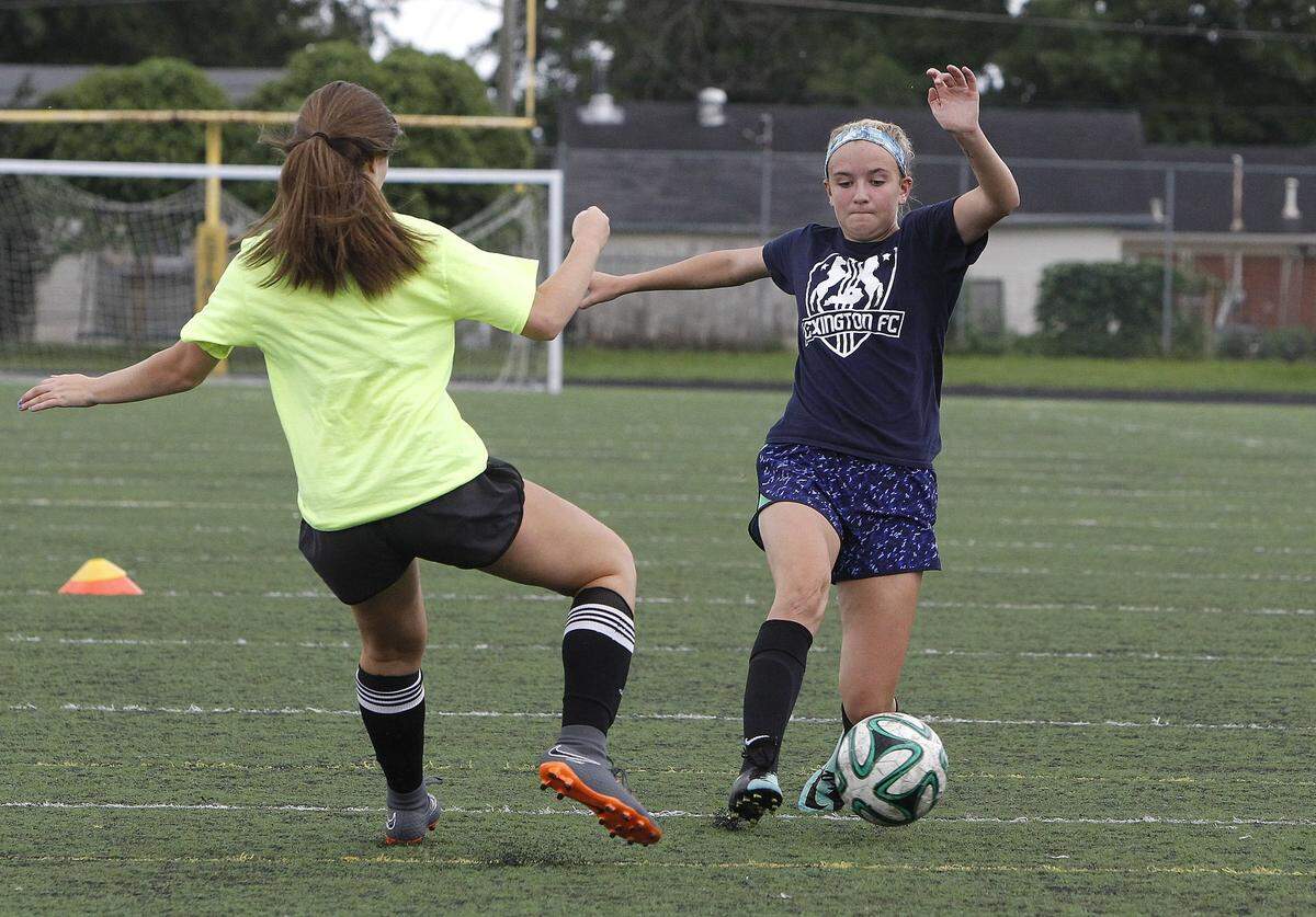 Bryan Station’s Hannah Muncie dribbled against Jocelyn Reynolds during a practice drill Aug. 2. Muncie and Reynolds are freshmen and probable starters on a very young Defenders’ team this season.