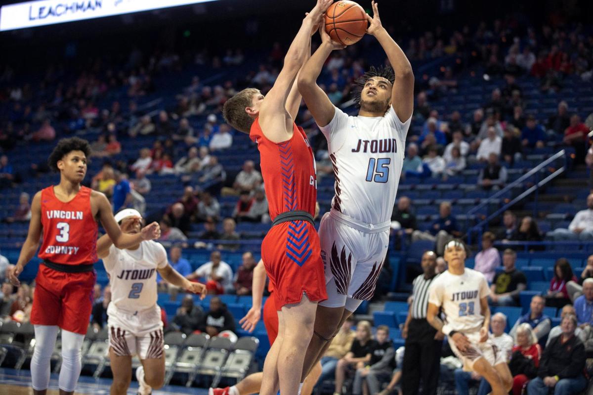 Jeffersontown’s Lukus McDaniels (15) tries to get off a shot while guarded tightly by Lincoln County’s Jackson Sims (4) during the opening game of the Boys’ Sweet 16 in Rupp Arena on Wednesday.