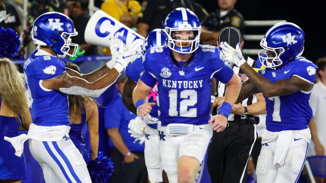 Kentucky wide receiver Dane Key (6), quarterback Brock Vandagriff (12) and wide receiver Barion Brown (7) celebrate a second-quarter touchdown against Southern Miss on Saturday at Kroger Field.