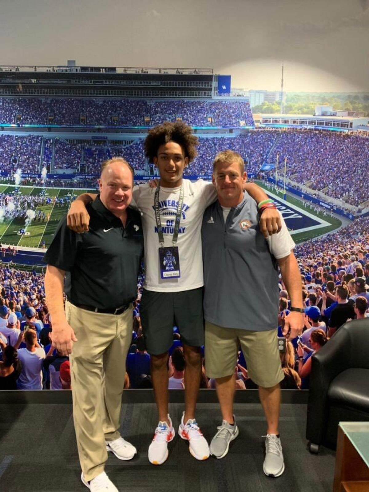 Dane Key, center, posed with Kentucky football coach Mark Stoops, left, and his Frederick Douglass coach, Brian Landis, on a recent recruiting visit to UK. Key, a sophomore wideout, has offers from UK, Louisville, Western Kentucky and Marshall.