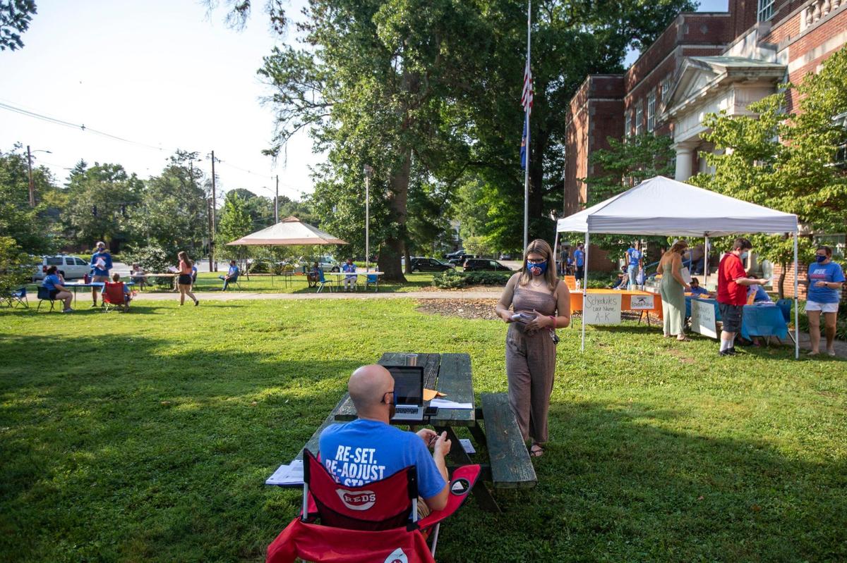 Macy Dungan talks with teacher Shane Hecker outside Frankfort High School on Tuesday, Aug. 26, 2020. A few days before the school year began, students were able to meet with their teachers and pick up their class schedules while wearing masks and physically distanced.