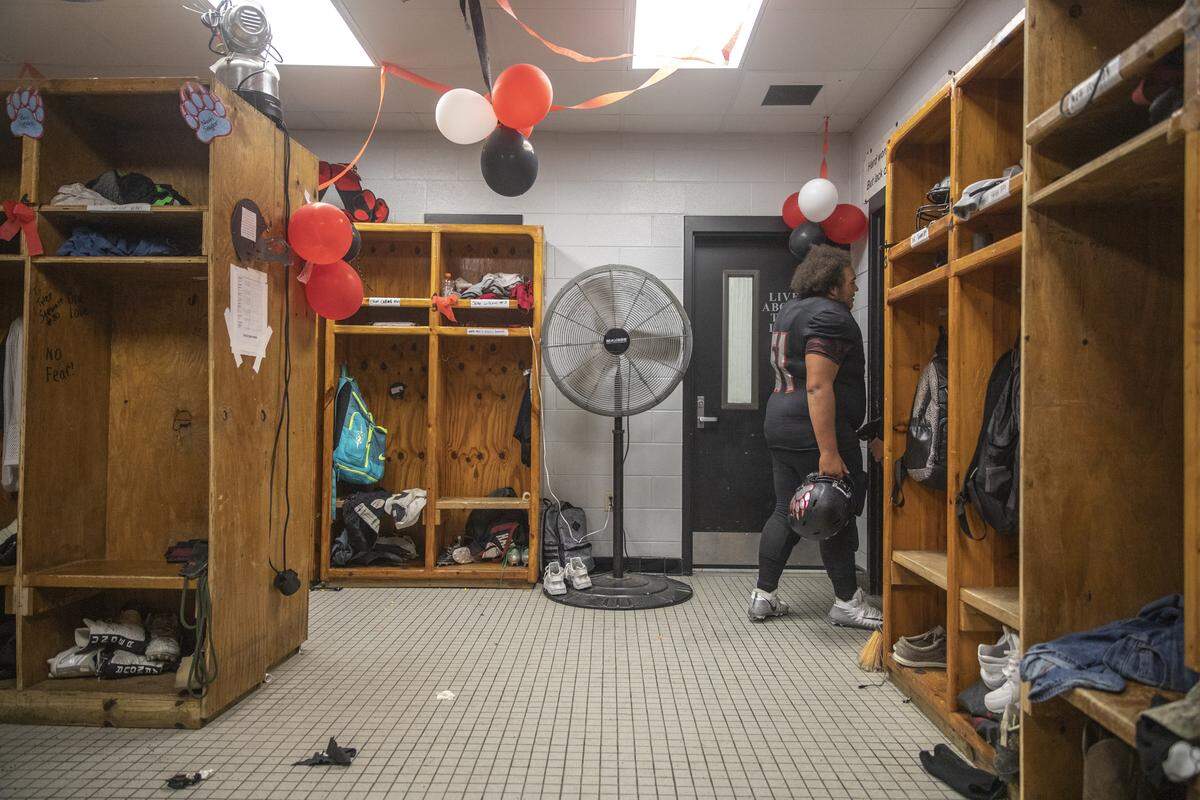 Alex Hamilton, of Harlan County, walks out of the locker room before the start of the game.