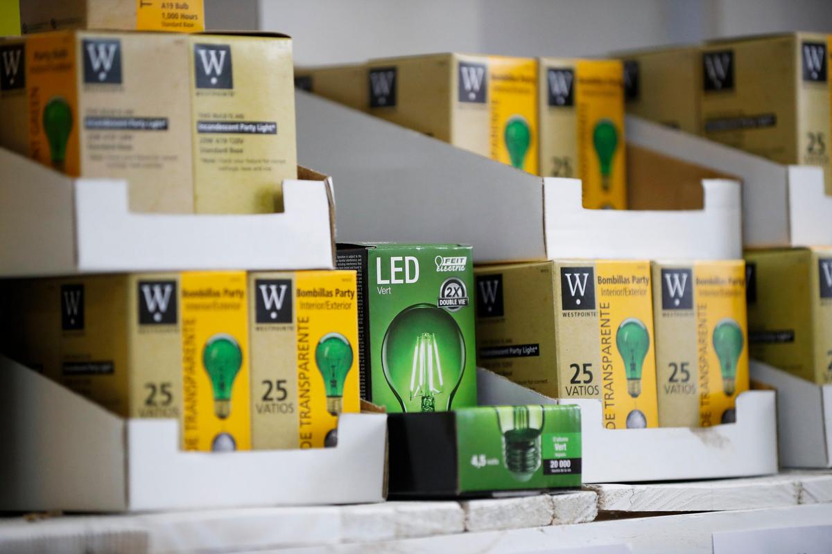 Green lightbulbs sit for sale at Chevy Chase Hardware..