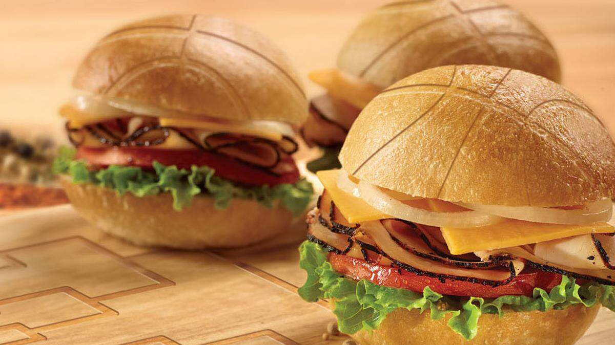 Frozen dinner rolls are easy to notch with a basketball pattern for some sliders featuring Boar's Head bold blackened turkey breast.  