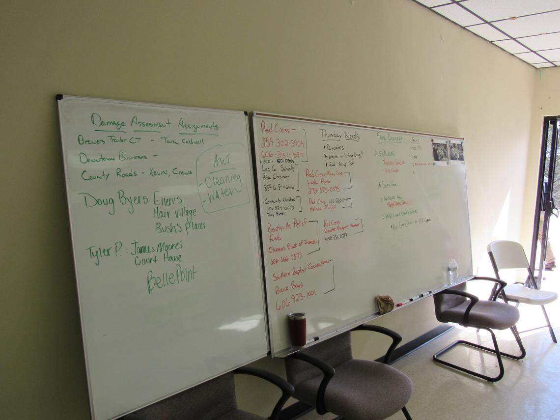 Emergency management officials in Lee County used a large white board to keep track of damage assessments, food deliveries and other needs on March 5, 2021 in the wake of a flood.