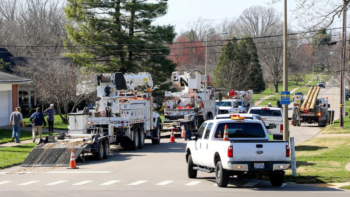 Trucks with the Public Service Company of Oklahoma sit on Jesselin Drive Monday, March 6, 2023 in Lexington, Ky. The crews were making repairs and putting up new electric poles after a strong wind storm knocked out power to much of Lexington, Ky three days earlier.