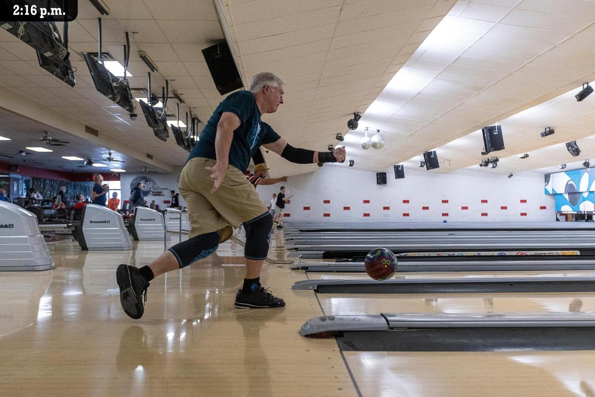 Joe White switches bowling between two separate lanes at Southland Lanes bowling alley on Southland Drive Friday, July 9. “I’ve been bowling for a long time. As you get older, you just don’t bowl as well as you used to,” he said. Joe had been bowling intermittently for 60 years, and had become a regular at Southland Lanes as he practices during the summer before joining a league in the winter for competitions. “I bowl here and in Richmond, just to try something different. Different lanes, different conditions.”