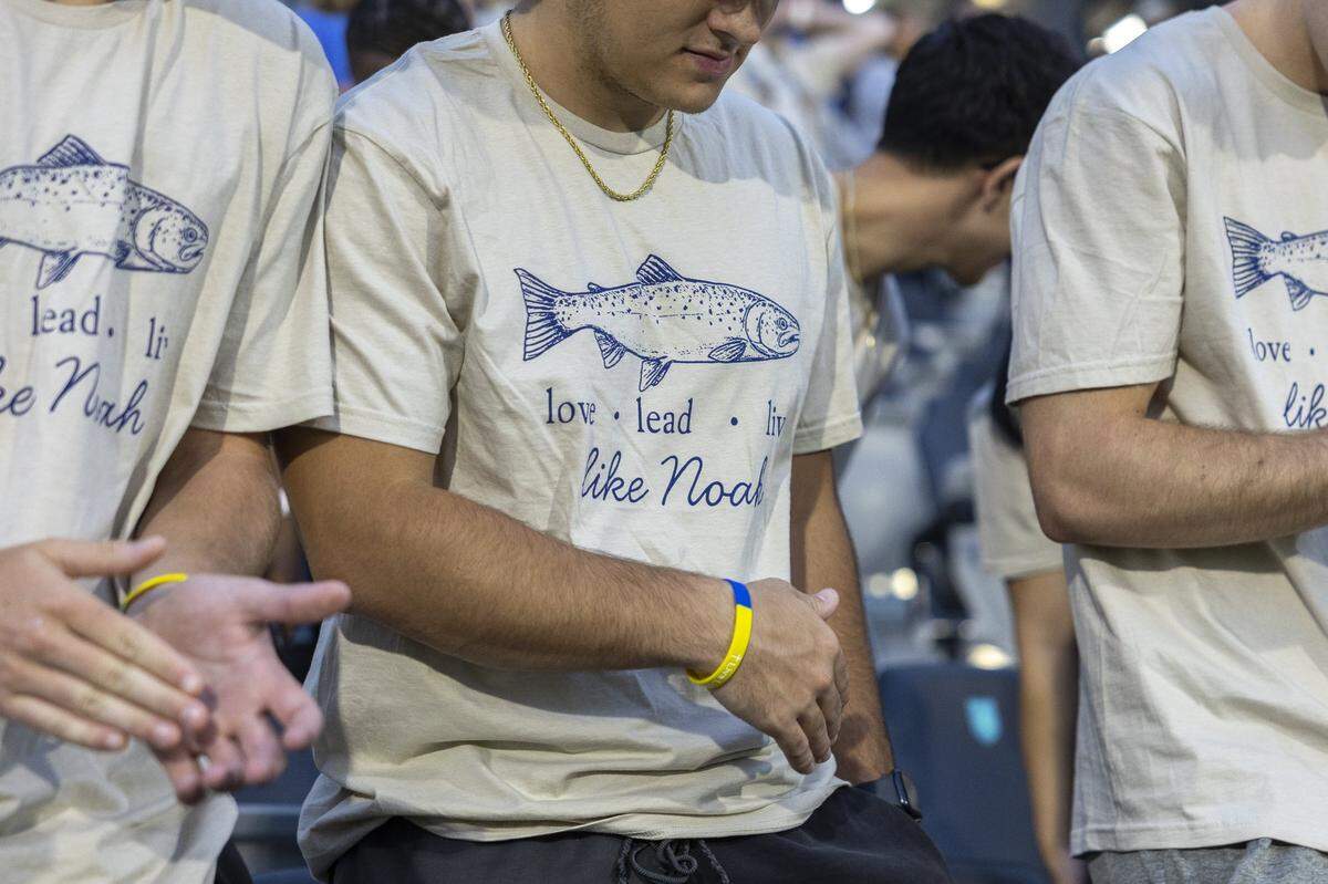 Spectators wear shirts honoring former Henry Clay player Noah Tinch, who died this summer, during a match between Henry Clay and Paul Laurence Dunbar at Lexington Sporting Club Stadium in Lexington, Ky., on Thursday, Aug. 28, 2025. It was the first high school game played at Lexington Sporting Club Stadium.