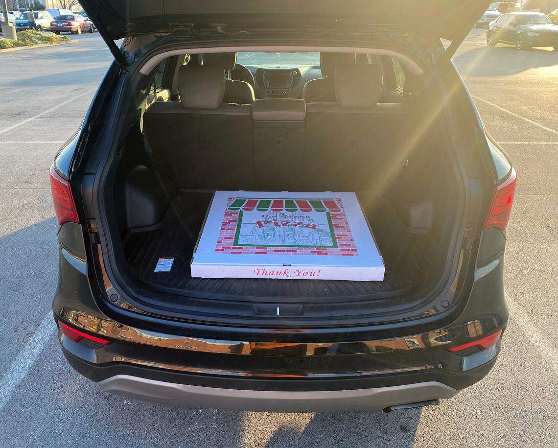 The box for the 28-inch Big Bambino pizza from Lexington’s Big City Pizza barely fits in the back of a mid-size SUV. The special order box measures 29 inches by 29 inches. Photo taken Jan. 10, 2021. 
