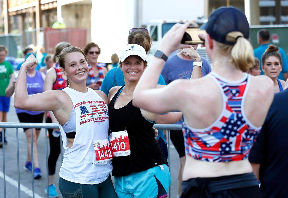 Kyrsten Becker took a photo of Rebekah Sams, left, and Sarah Martin, after they finished the 42nd annual Fourth of July Bluegrass 10,000 road race through downtown Lexington. The overall winner was Zack Beavin and the top female finisher was Katy Kunc.