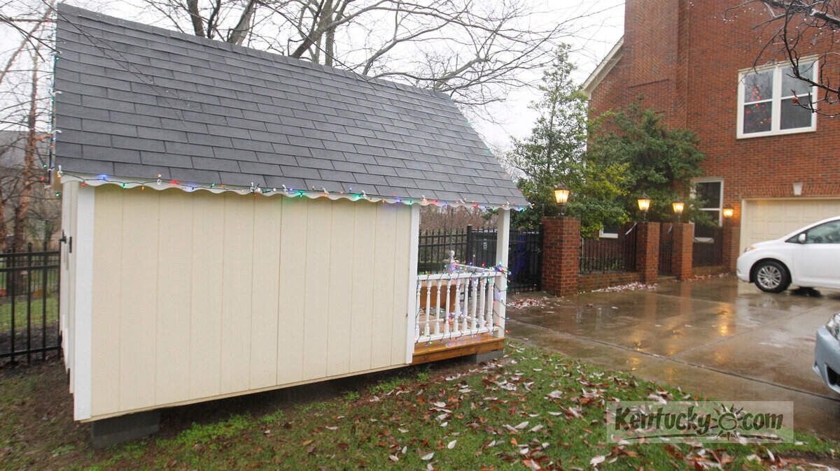 The playhouse is beside the driveway, in front of the Veloudis' fenced-in back yard, as shown on Monday, Dec. 5, 2011.  The Veloudis home is at right. Cooper Veloudis is a 3-year-old with cerebral palsy.  His parents bought him a $5,000 playhouse to aid in his physical therapy, but the Andover Forest Homeowners' Association says it violates their bylaws and it must be taken down.  There is quite a public controversy over the homeowners' association's decision.  Photo by David Perry | Staff

