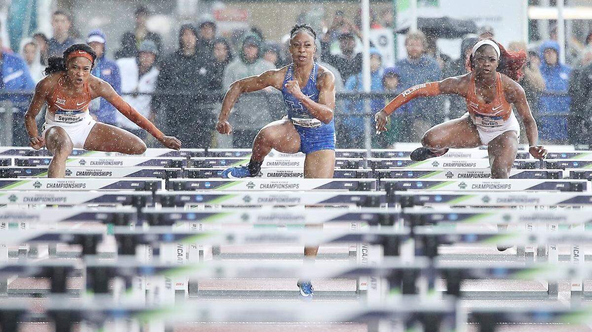 Kentucky's Jasmine Camacho-Quinn battled the field, and the rain, on her way to the 100-meter hurdles championship at the NCAA outdoor championships.