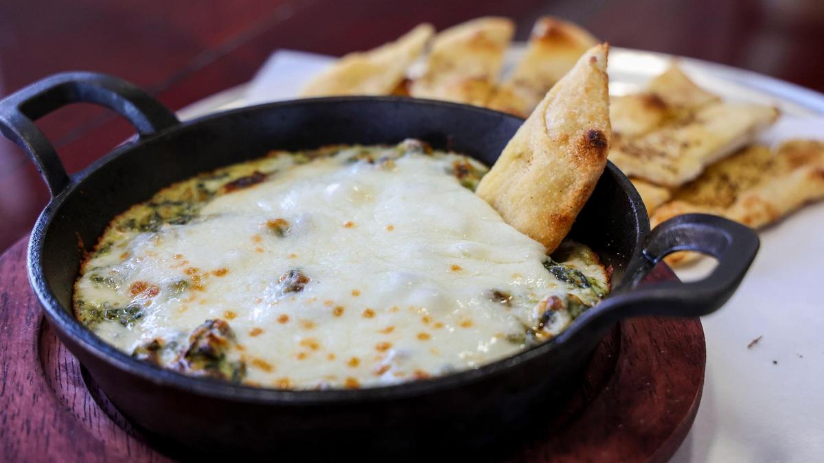 Spinach and artichoke dip ($11.) at Black-Type Brewing. The appetizer uses housemate dough baked in the wood-fired oven.