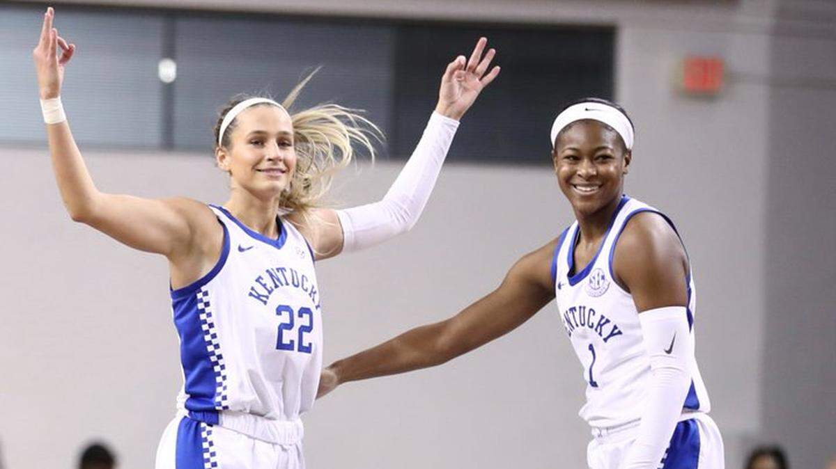 Kentucky’s Maddie Scherr, left, celebrates with teammate Robyn Benton during their team’s victory against Missouri on Sunday at Memorial Coliseum.