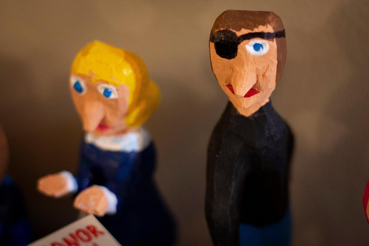 The characters carved by Minnie Adkins are wooden illustrations that accompany poems written by Mike Norris in their collaborative book, “Ring Around the Moon.”