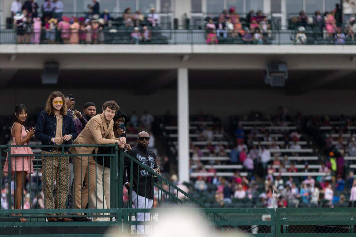 Louisville rapper Jack Harlow, in the tan suit, makes an appearance above the infield before the 148th running of the Kentucky Oaks at Churchill Downs in Louisville, Ky., Friday, May 6, 2022.