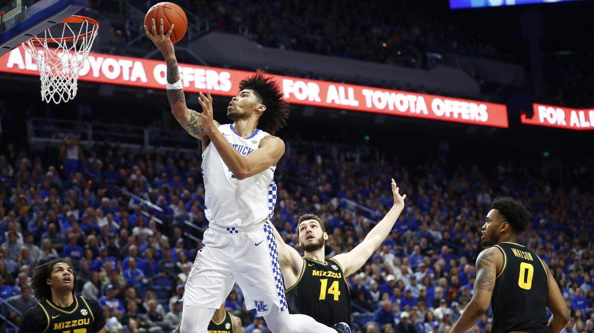 Kentucky Wildcats forward Nick Richards (4) scores past Missouri Tigers guard Dru Smith (12) and Missouri Tigers forward Reed Nikko (14) during their game at Rupp Arena in Lexington, Ky., Saturday, Jan. 4, 2020.