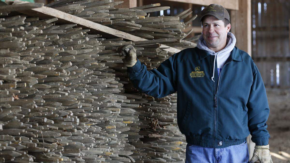 David DeMarcus stood by some of the tobacco sticks on his farm in Lexington, where he raises cattle and grows tobacco and corn. The address, 3333 Royster Road, is an homage to his big game.