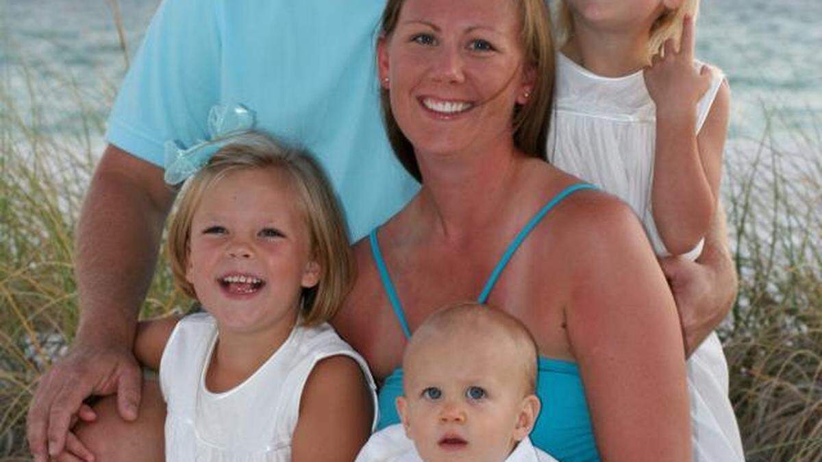 Sarah Hart posed in an undated family photograph with husband Ryan, daughters Avery and Addison and son Archer. Hart was killed Thursday while returning to her car after an early jog.