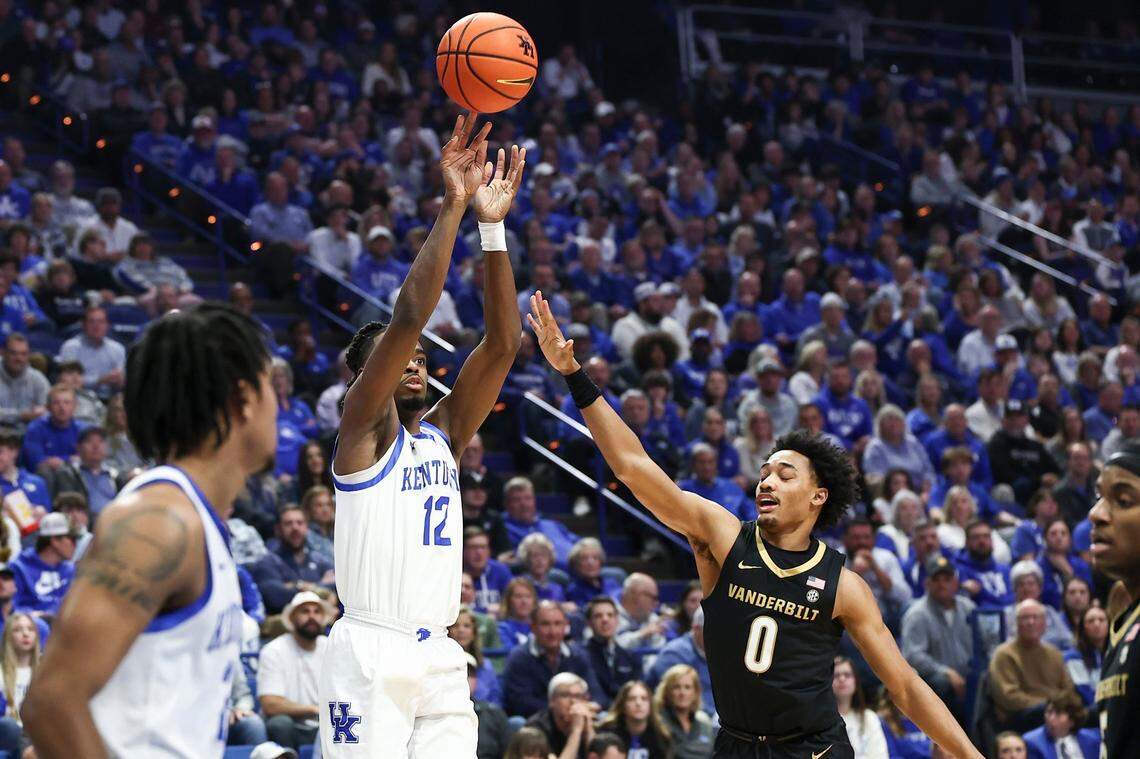 Kentucky Wildcats guard Antonio Reeves (12) shoots the ball over Vanderbilt Commodores guard Tyrin Lawrence (0) during the game at Rupp Arena in Lexington, Ky, Wednesday, March 6, 2024.