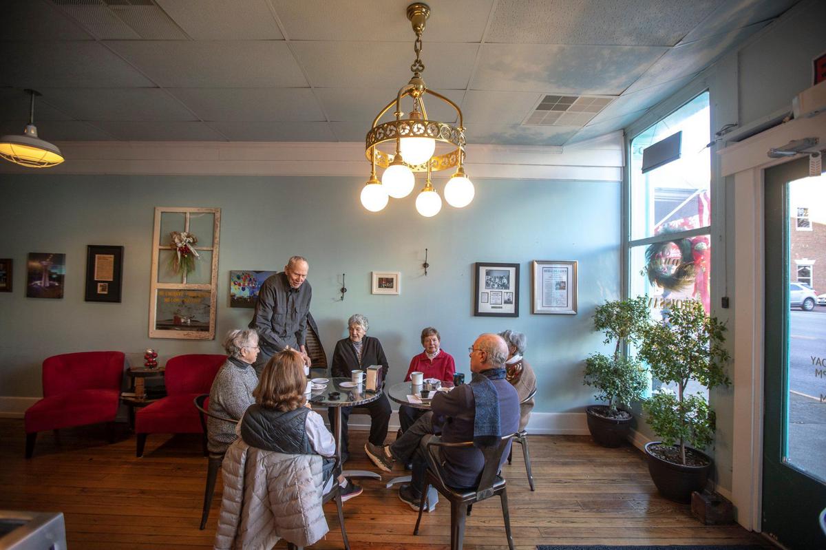 Customers drink coffee and chat at Spoonful of Sugar, Sweets and Such in Mt. Sterling.