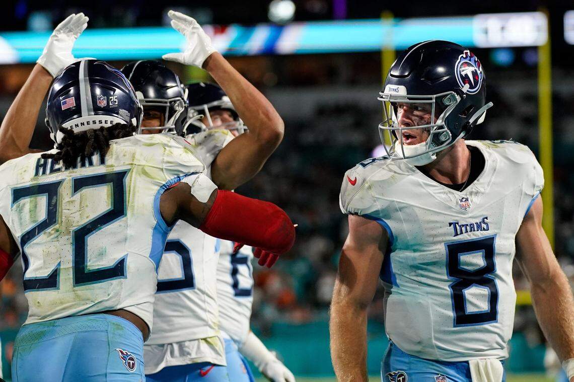 Tennessee Titans quarterback Will Levis (8) looks on as running back Derrick Henry (22) celebrates his touchdown that proved to be the game-winner against the Miami Dolphins on Monday night.