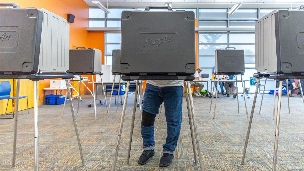 A voter completes their ballot at Lexington Public Library’s Northside Branch on Tuesday, May 21, 2024.