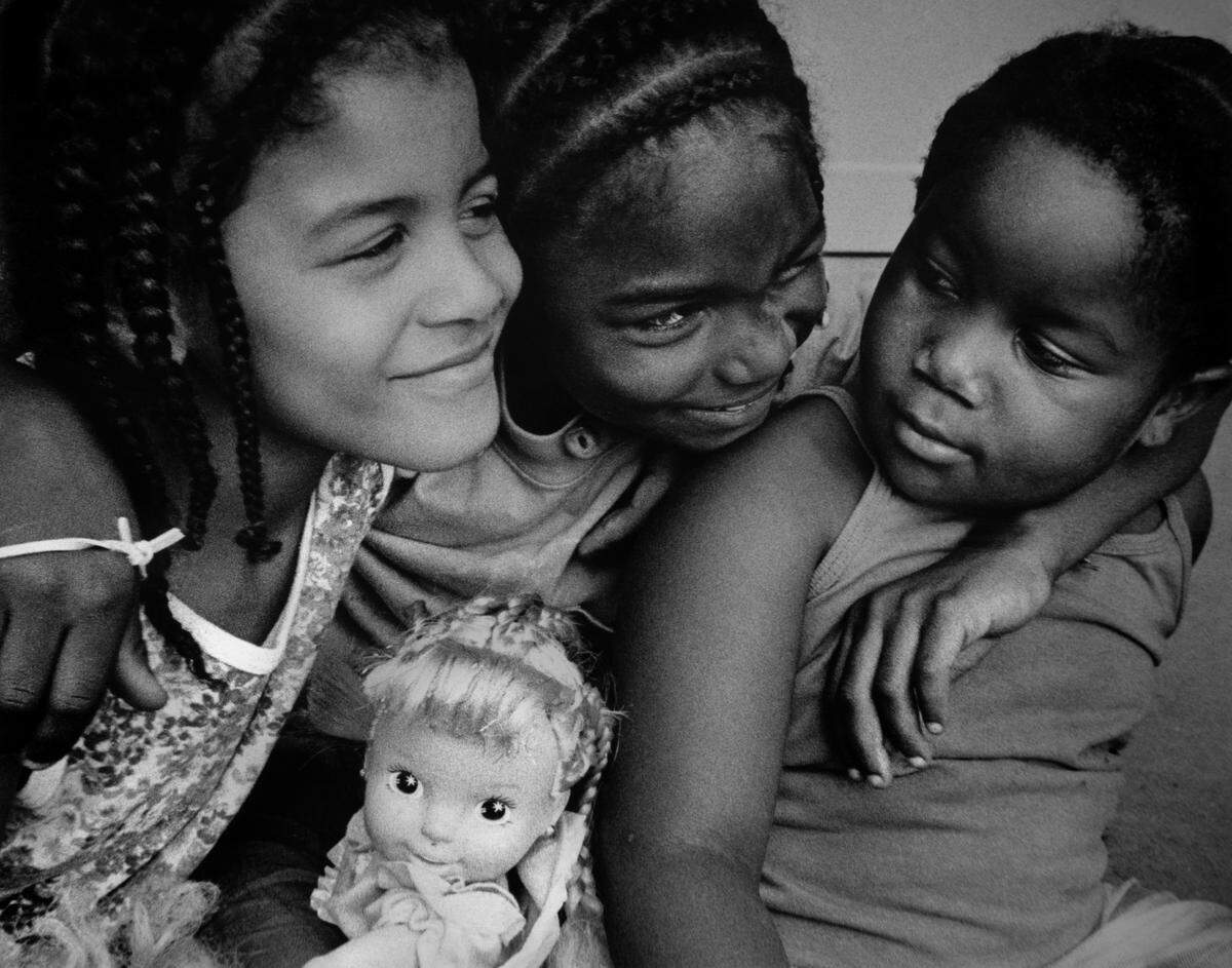 Children at play pause for a portrait in the early 1990s in Lexington, KY. (Photo by Jahi Chikwendiu) For one-time use by the Lexington Herald-Leader.