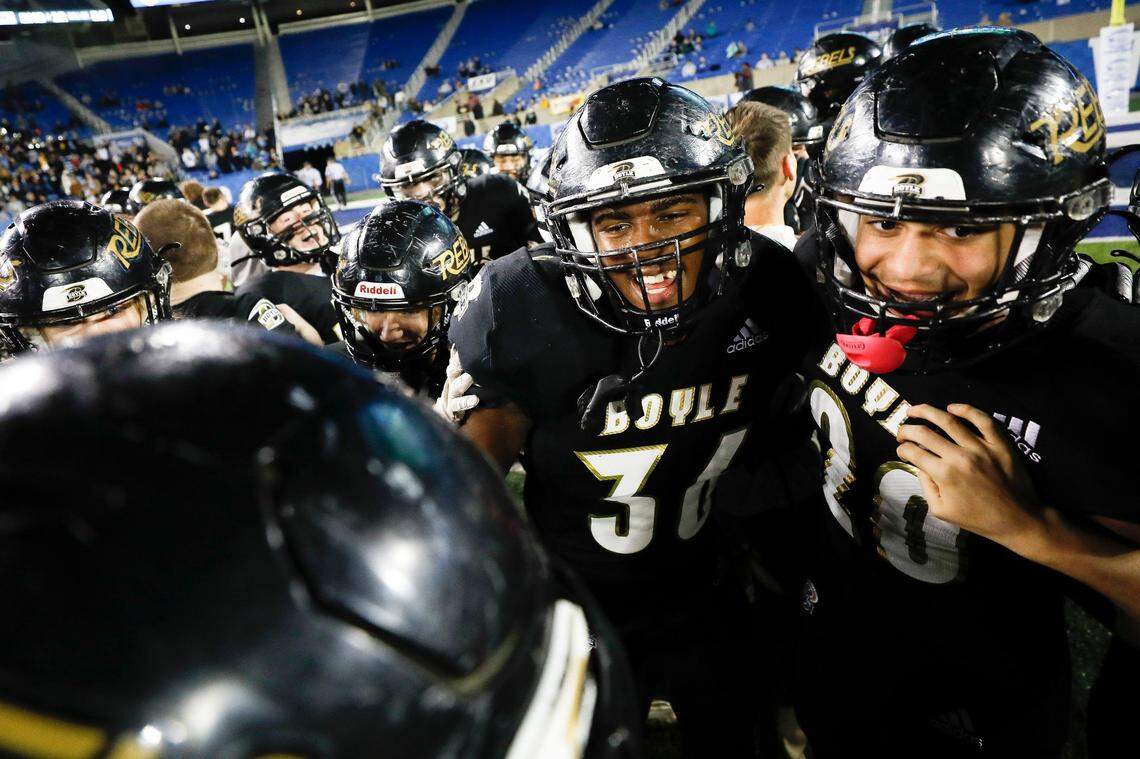 Boyle County’s Tommy Ziesmer (36) and Brock Driver (20) celebrate after the Rebels beat Johnson Central 30-13 in last year’s Class 4A state championship game at Kroger Field.